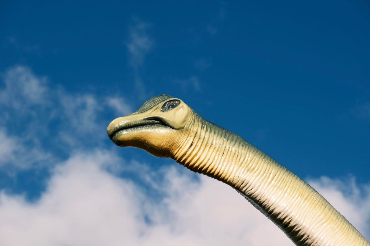 a dinosaur on a cloudy day