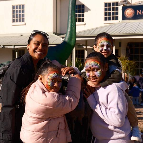 a man and a woman standing in front of a building