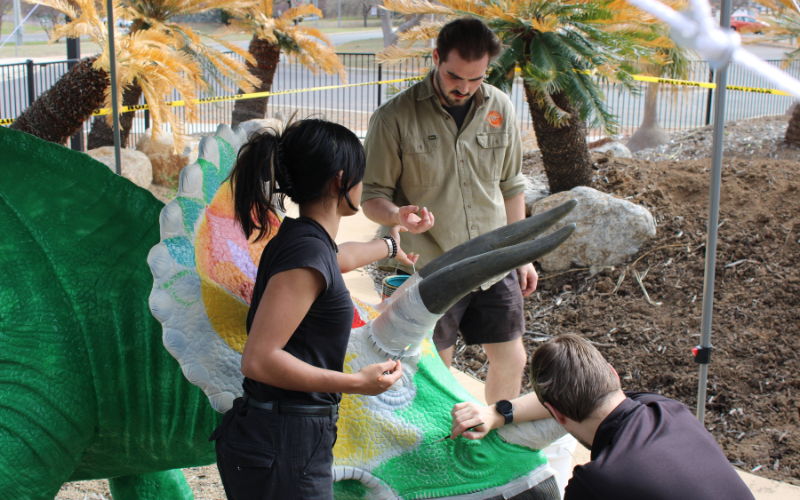 National Dinosaur Museum staff work on painting Florasaurus for Floriade About Town